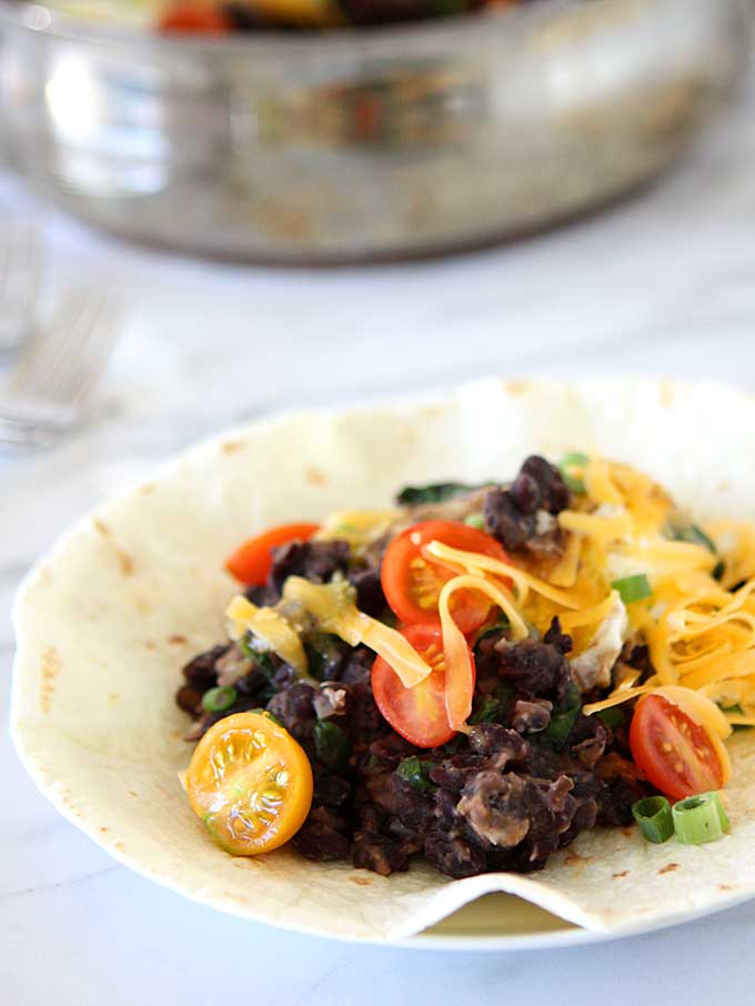 Southwest Refried Black Beans with Spinach & Eggs | thekitchenpaper.com
